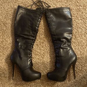 Black laced up knee high boots